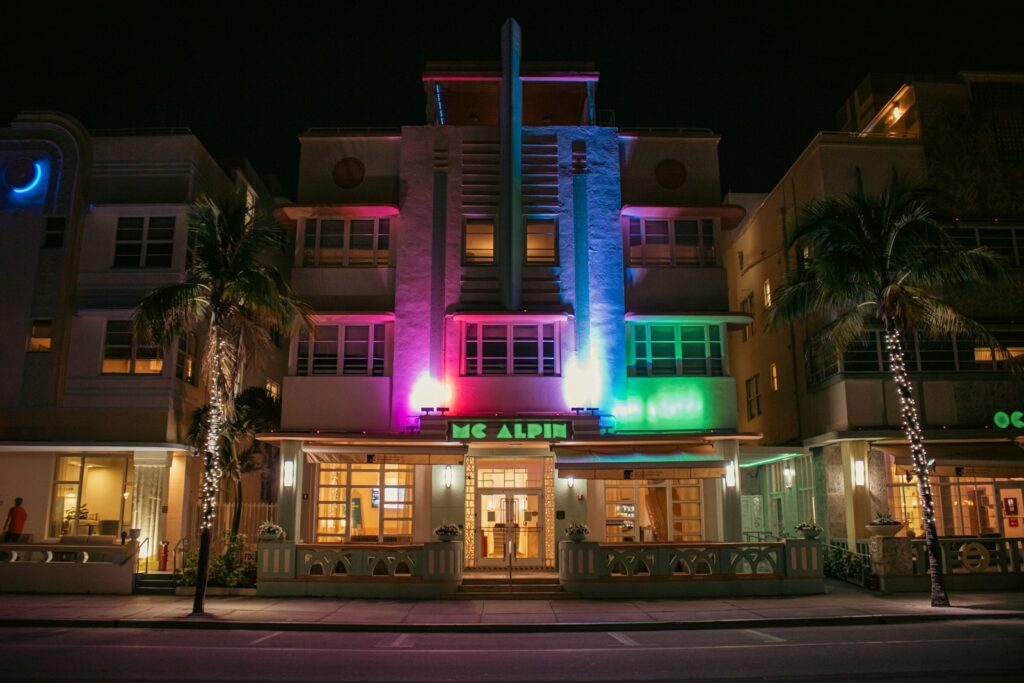 A colorful building is lit up at night.